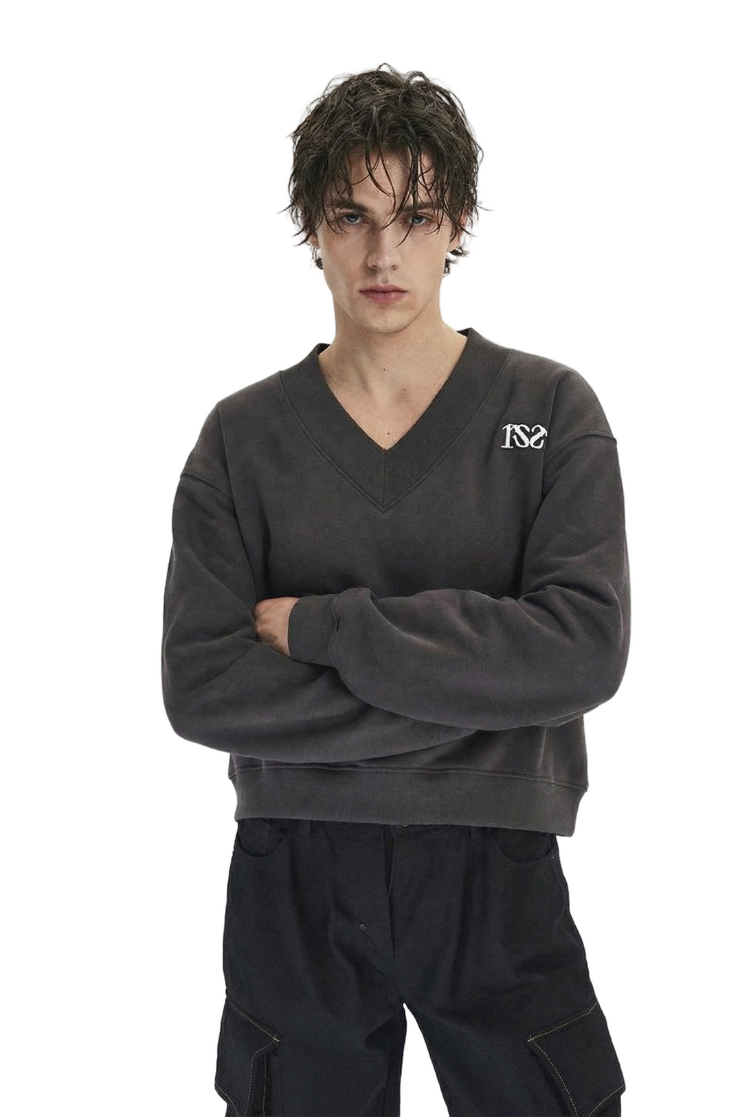 Person wearing a dark gray sweatshirt with a logo on a white background